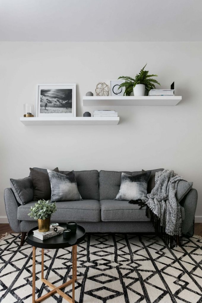 floating shelves above couch